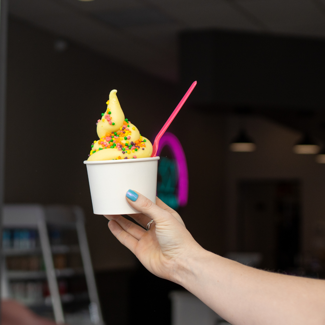 Hand holding frozen yogurt